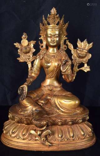 A Chinese/Tibetan gilded bronze Buddha. 29 x 22cm