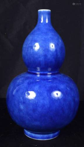 A Chinese porcelain blue ground double gourd vase. 23cm