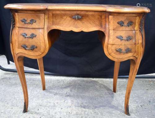 An early French 20th century Tulip wood and marquetry 5 draw...