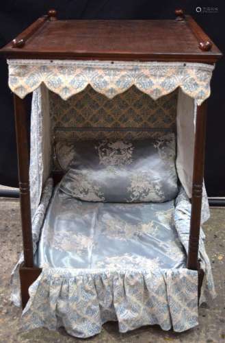 An early 20th Century upholstered miniature Tester bed possi...