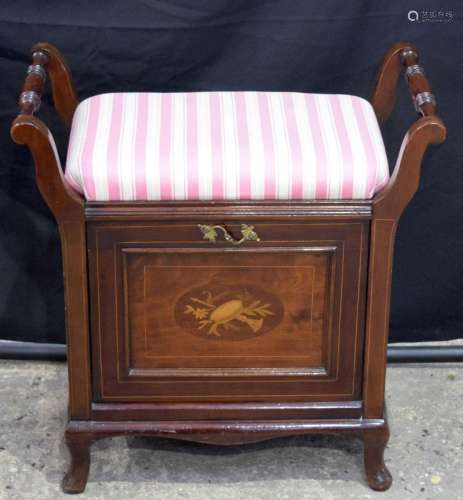 A lovely antique mahogany piano stool with a storage and a m...