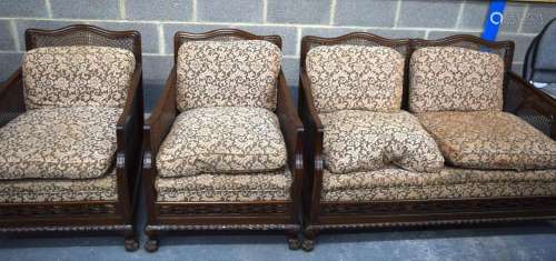 A Bergere style caned salon suite with floral upholstered se...