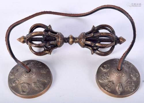 A bronze Tibetan Buddhist Dorje together with a pair of chim...