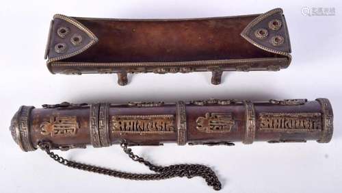 A Tibetan bronze incense stick holder together with an incen...