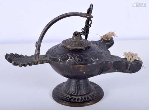 A small Persian bronze oil lamp 10 x 15 cm.