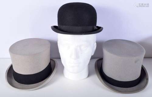 Two vintage Top Hats and a bowler hat by Lock and Co of St J...