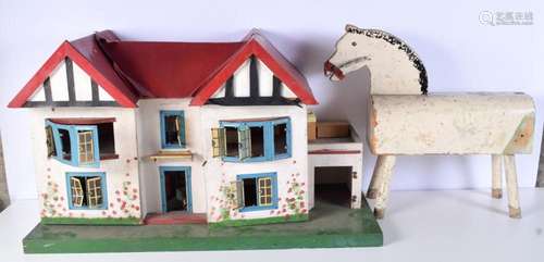 An early 20th Century wooden dolls house containing furnitur...