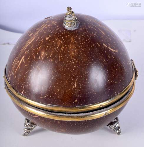 An antique hinged lid coconut box with plated scrolling moun...