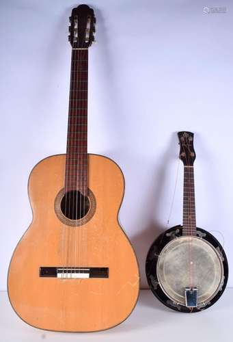 A Puig Y Ramos Spanish guitar together with a Melody Uke Uku...