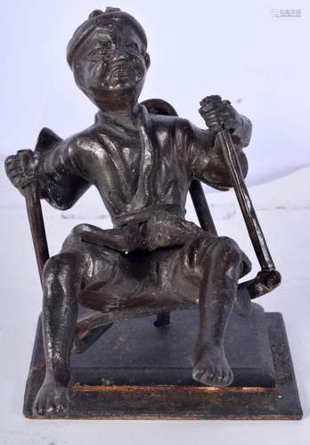 A South East Asian bronze figure of a male on a swing 16 cm ...