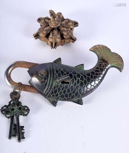 A South East Asian metal Fish lock together with a Hindu Tik...