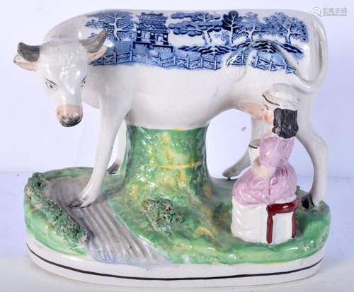 An 19th century English Staffordshire figure of Milk maid an...