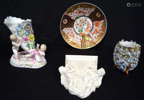 A group of ceramics including a Parian ware cherub wall hang...