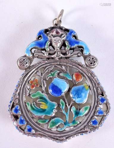 A small Chinese carved Jade pendant decorated with enamelled...
