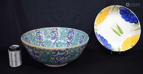 A large Islamic glazed pottery bowl together with an Italian...