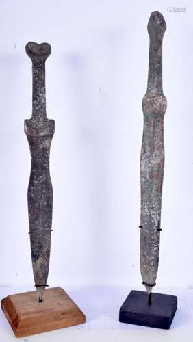 A pair of Chinese daggers with stands. Largest 39cm (2)