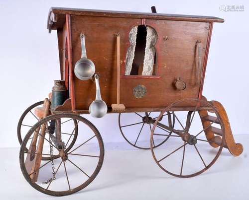 A large antique wooden model of a caravan with assorted dome...