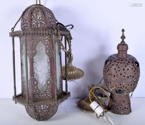 A large Middle Eastern metal hanging lampshade together with...