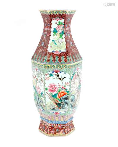 A Canton baluster vase,profusely decorated birds and flowers...