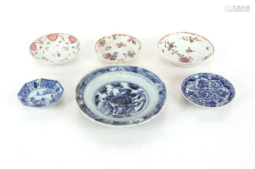 A Chinese shallow dish,with shaped border and central mystic...