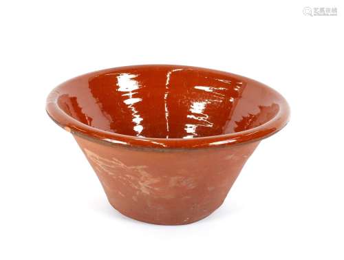 A brown glazed earthenware dairy bowl,43m dia.