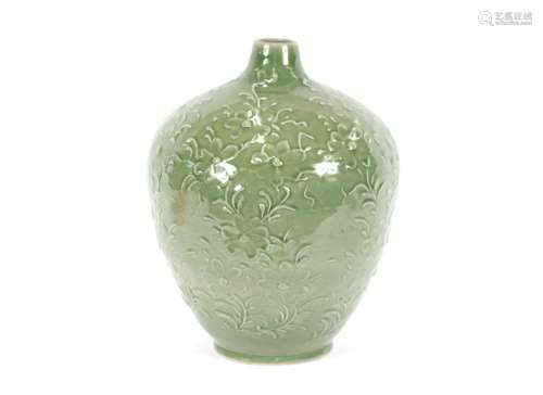 A large Chinese celadon ground vase,having raised floral dec...