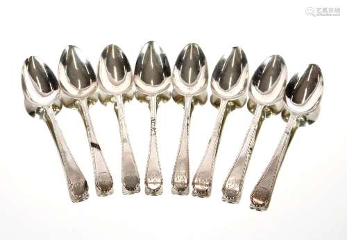 A set of eight George III silver feather edge teaspoons,Lond...