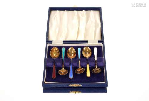 A cased set of six silver gilt and enamel coffee spoons