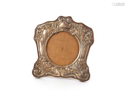 An Edwardian silver mounted easel photographframe,in the Art...