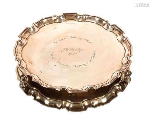 A presentation silver salver,with pie crust border raised on...