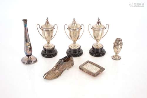 Three small silver trophy cups;a 19th century silver vase sh...