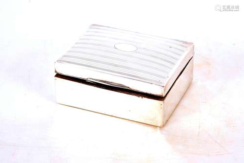 A silver wooden lined cigarette box,with engine turned decor...