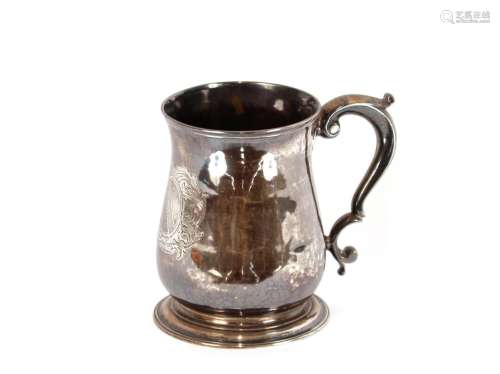 A George III silver baluster tankard,with scroll handle, eng...