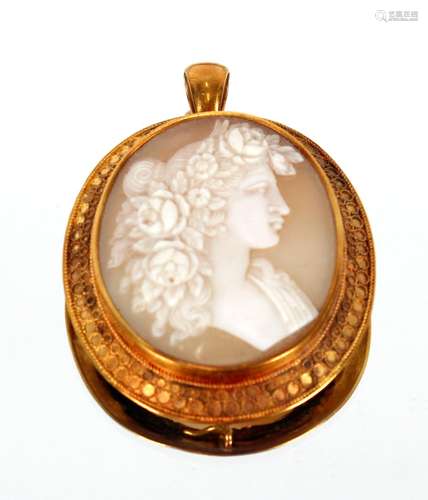 A large yellow metal cameo brooch / pendant,carved with clas...