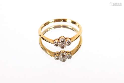 An 18ct gold and four stone set cluster ring