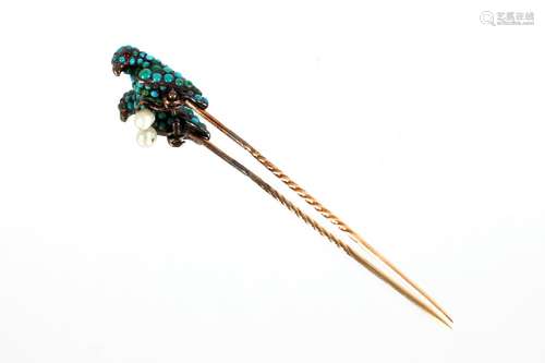 A yellow metal stick pin,with turquoise encrusted figure of ...