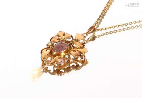 An Edwardian gold pearl and amethystset pendant, hung to a f...