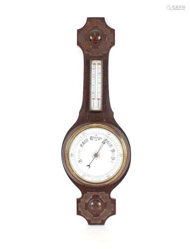 An Edwardian oakbanjo barometer / thermometer,77cm