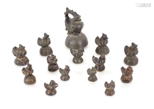 A collection of fourteen Oriental bronze Opium weights