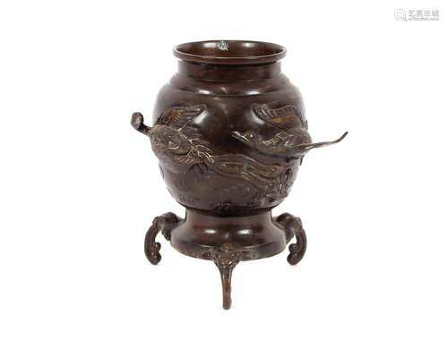 An Oriental bronze censer,raised on three beast feet, the bo...