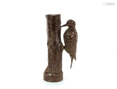 A bronze study of a Woodpecker,pecking a tree stump in half ...