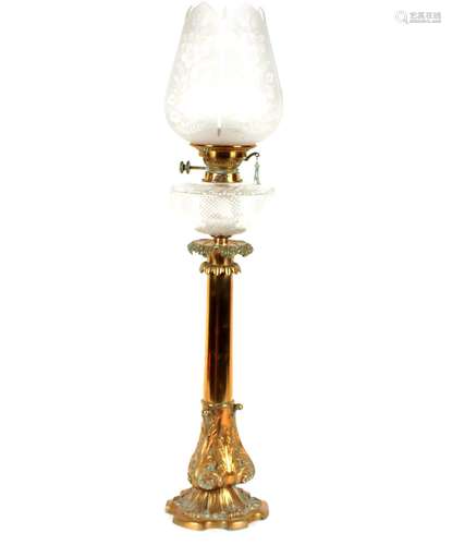 A Victorian brass oil lamp,with cut glass reservoir and etch...