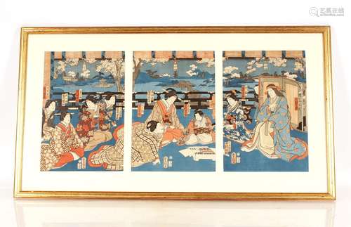 A Japanese wood blocktriptych, by Kunisada, scene of an even...