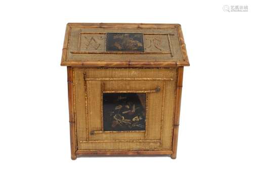 An unusual 19th Century bamboo sloping topped cabinet,having...