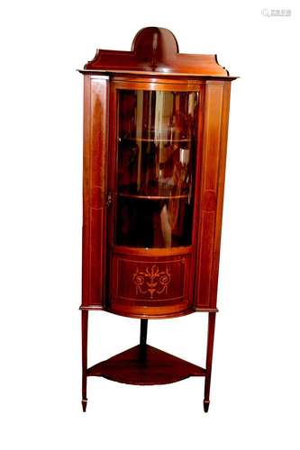 An Edwardian inlaid mahogany corner display cabinet,the inte...