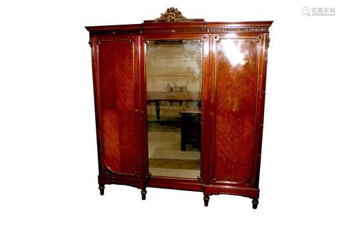 A 19th Century French walnut breakfront wardrobe,the pedimen...