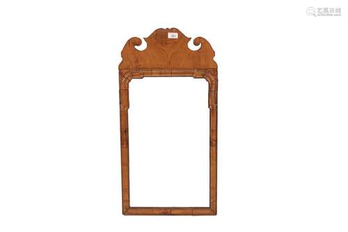 A walnutframed Chippendaledesignwall mirror,having fret carv...