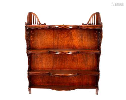 A Chippendale style carved mahogany hanging wall shelf,with ...