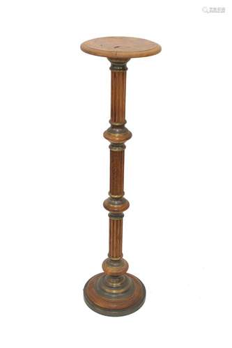 An inlaid walnut torchere stand,raised on a fluted column