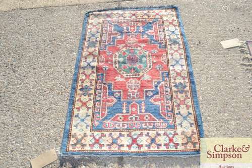 An Eastern wool rug, of Caucasian design with geom